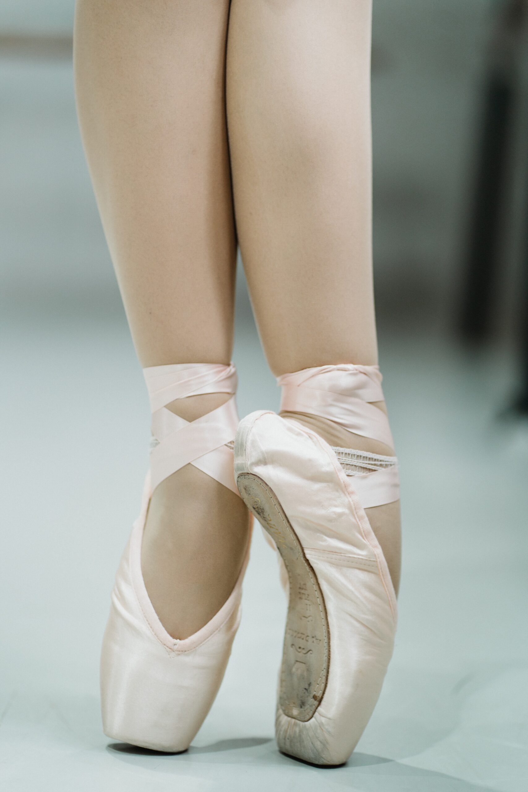 ballet shoes being worn and ballet pose close up of feet